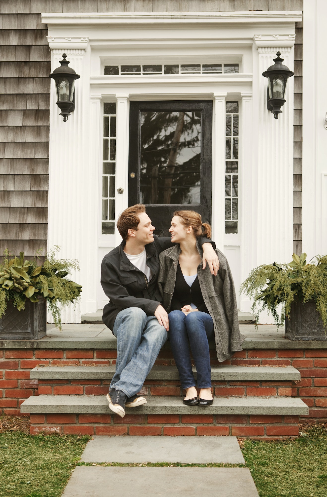 Couple Sitting On Front Stoop